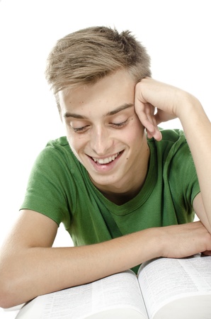 Attractive and handsome young man enjoys readingの写真素材
