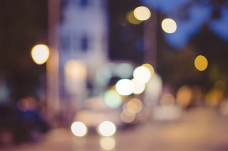 beautiful background of bokeh lights at night on road with carの写真素材