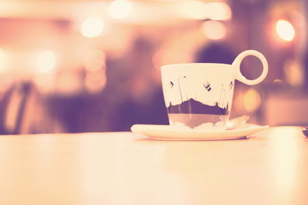 Coffee cup in coffee shop - vintage style effect pictureの写真素材