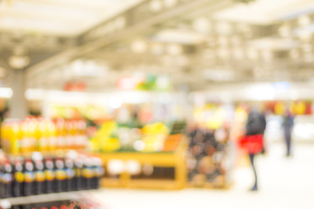 Blur market background with bokeh and silhouettes of customersの写真素材