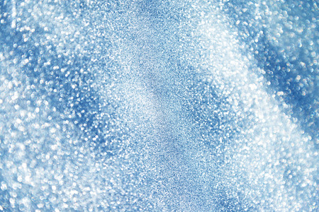 abstract bokeh background, shining lights, holiday sparkling atmosphere, celebration ambient, luxury glittering silver backgroundの写真素材