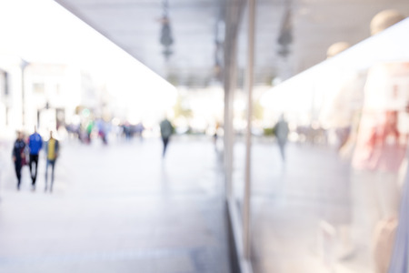 Blurred background. Blurred people walking through a city street.の写真素材