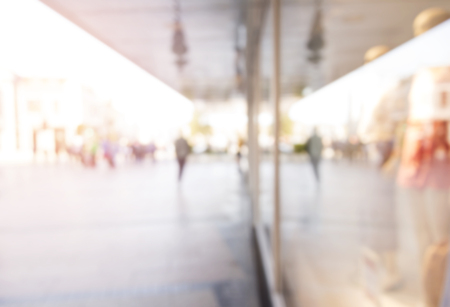 Blurred background. Blurred people walking through a city street.の写真素材