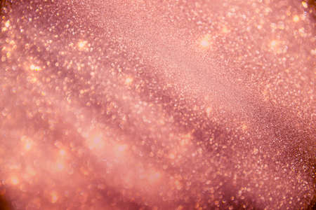 abstract defocused lights, sparkling holiday bokeh background with golden tones, elegant christmas backdropの写真素材