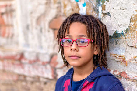 close up portrait of a cute African American boy with eyeglassesの写真素材