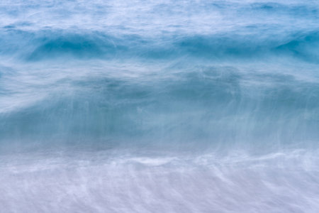 Blue sea wave in motion blur. Abstract background and texture for design.の写真素材