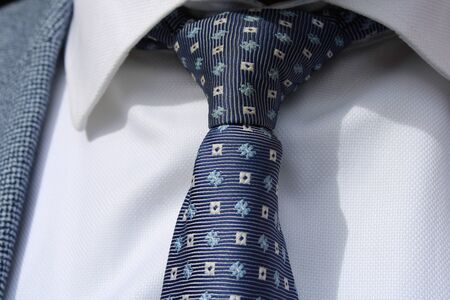 different tie knots with different shirts colorの写真素材