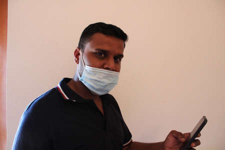 young asian man with mask on faceの写真素材