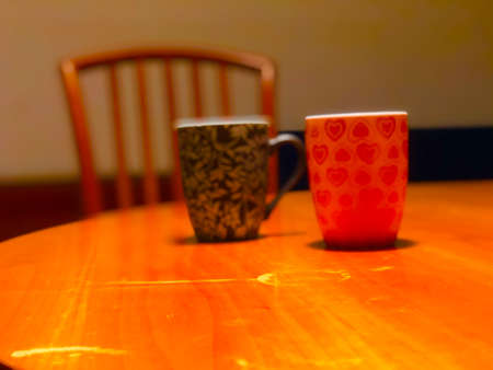 coffee mugs on the table and chair in the dinning roomの写真素材