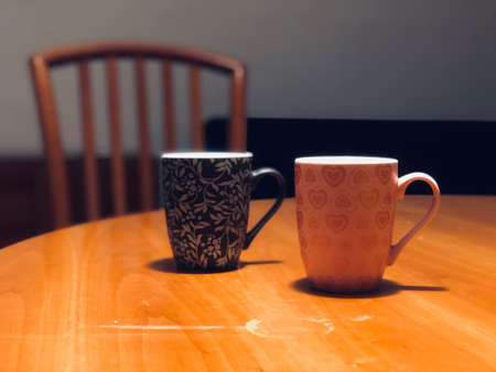 coffee mugs on the table and chair in the dinning roomの写真素材