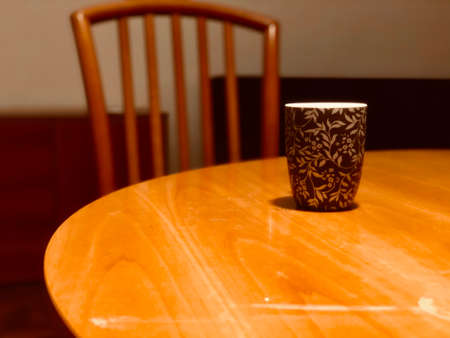 coffee mugs on the table and chair in the dinning room