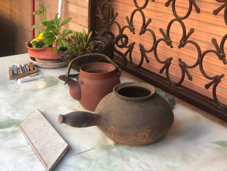antique old pots in the home backyard for decoration of home by old potsの写真素材