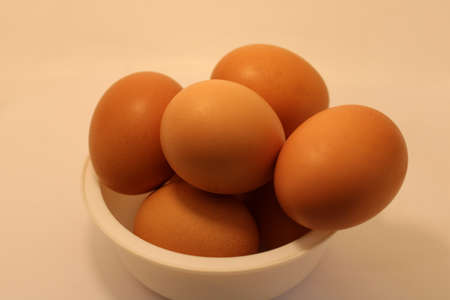 eggs in plastic bowl in kitchen eggs are important part of foodの写真素材