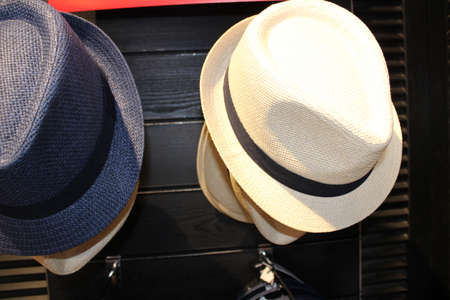 man hat on display of a garment storeの写真素材