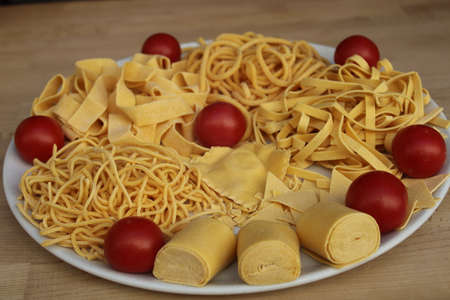 italian pasta uncooked pasta an important italian dish in italian cuisineの写真素材