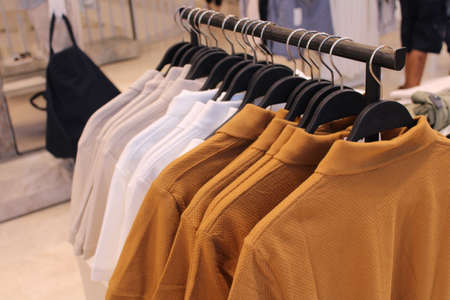 shirts hanging on a garment store in rome italyの写真素材