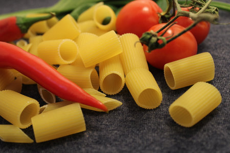 uncooked pasta raw pasta on tableの写真素材