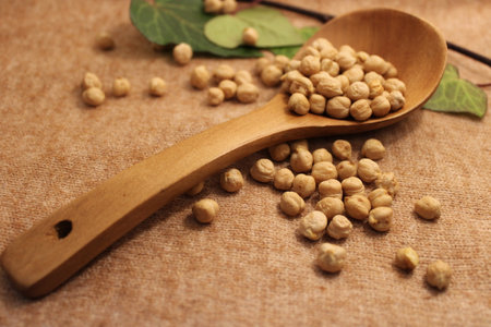 chickpeas on table in kitchen with kitchen utensilsの写真素材