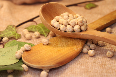 chickpeas on table in kitchen with kitchen utensilsの写真素材
