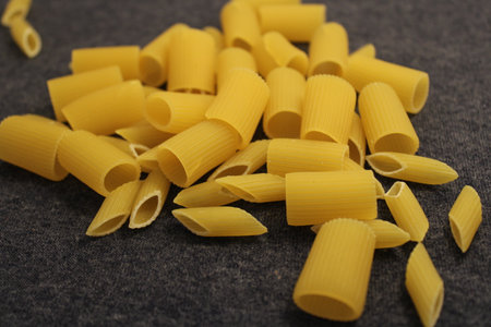 uncooked pasta raw pasta on tableの写真素材