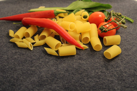 uncooked pasta raw pasta on tableの写真素材