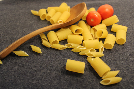 uncooked pasta raw pasta on tableの写真素材