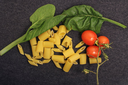 uncooked pasta raw pasta on tableの写真素材