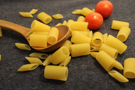 uncooked pasta raw pasta on tableの写真素材