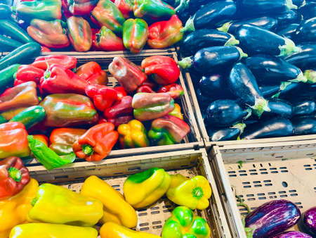 Colorful bell peppers on the counter of a farmers market. Selective focus.の写真素材