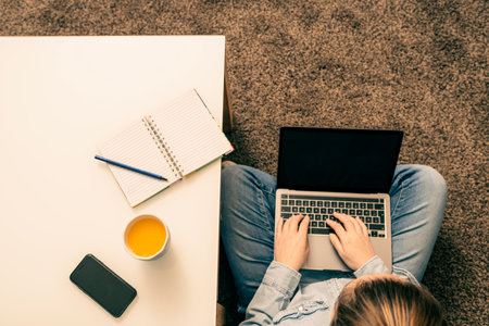 Creative Woman Using A Laptop While Working At Home Top view