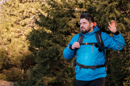 A male traveler hiking forest adventure travel active lifestyle.