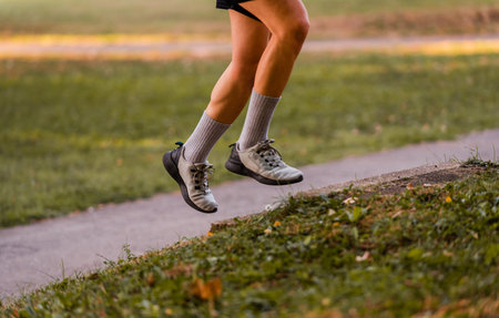 Cropped image of a sporty running man in cross country trail run.