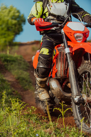 Professional enduro bike rider on action. Motocross sport.