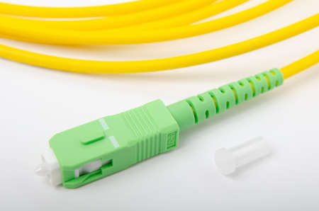 Optical SC green connector on an isolated background close-up, for connecting to the Internet, television or local area network, GPONの写真素材