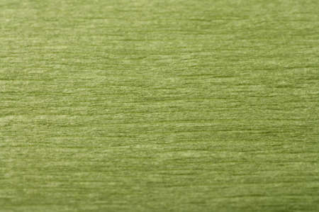 Background of dark green pressed corrugated paper with a horizontal texture taken close-upの写真素材