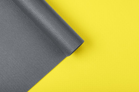 Two yoga mats in fashionable colors illuminating yellow and gray shot from above close upの写真素材