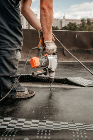 roof repair. a roofer repairs the roof. roofing toolsの写真素材