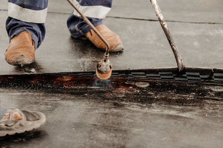 roof repair. a roofer repairs the roof. roofing toolsの写真素材