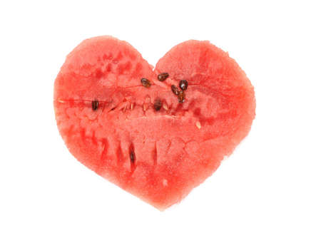 Water-melon pulp it is cut out in the form of heartの写真素材