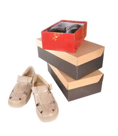 Man's boots and boxes with boots cost on a counter