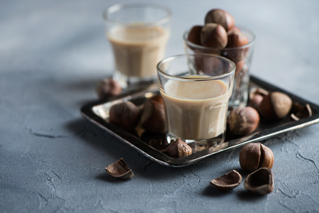 Cream liqueur with hazelnuts, homemade, selective focus, toned image の写真素材