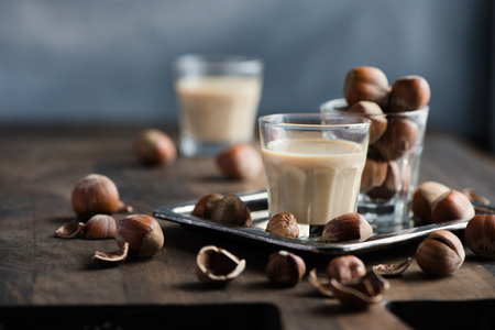 Cream coffee liqueur with hazelnuts, homemade, selective focus, toned image の写真素材