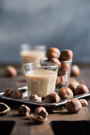 Cream liqueur with hazelnuts, homemade, selective focus, toned image の写真素材