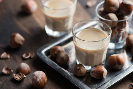 Cream liqueur with hazelnuts, homemade, selective focus, toned image の写真素材