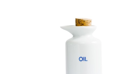 oil and vinegar bottles on white backgroundの写真素材