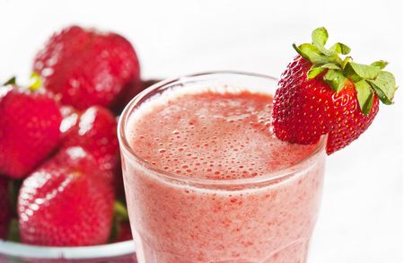 glass of freshly made strawberry smoothieの写真素材