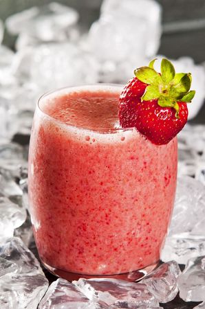 glass of freshly made strawberry smoothieの写真素材
