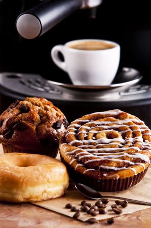 Fresh doughnut and cookies with an espressoの写真素材