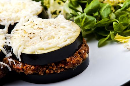 A delicious traditional greek moussaka served with saladの写真素材