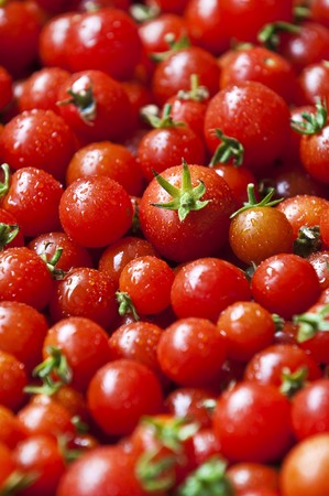 A lot of organic red cherry tomatoes の写真素材